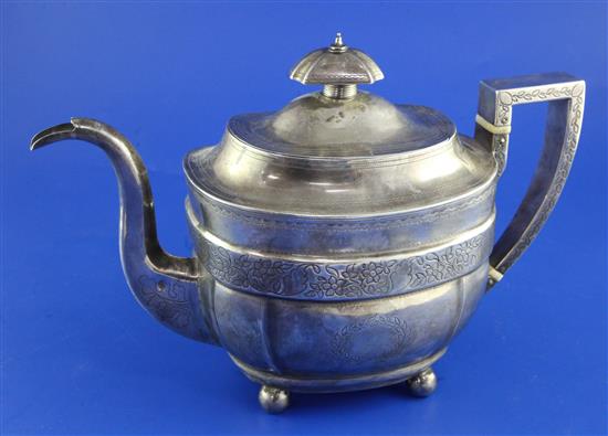 A George III silver teapot, gross 19.5 oz.